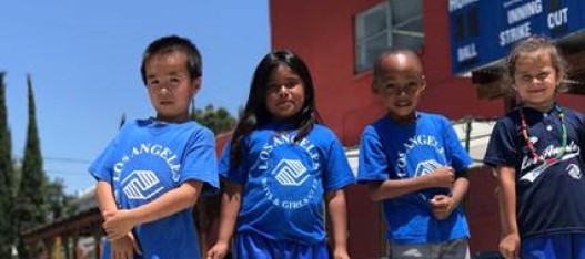 Photo of 4 children wearing blue LABGC shirts